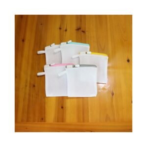 Laundry bead mesh bags hanging on wall