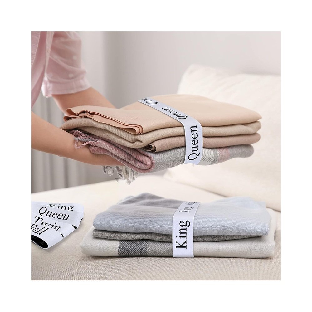 Sheet organizer band wrapped around folded sheets