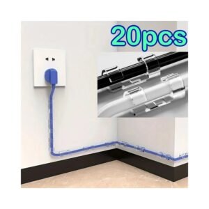 Adhesive cable clips holding cords near a desk