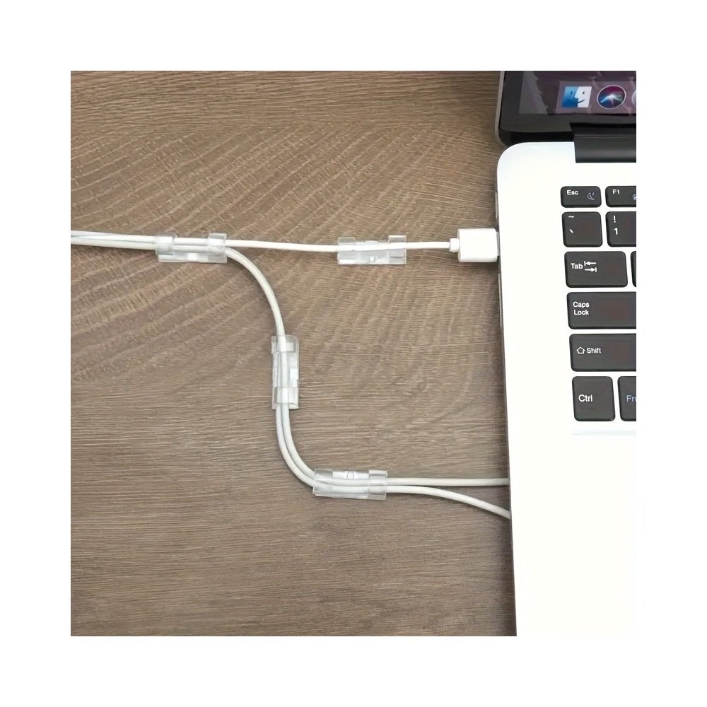 Adhesive clip holding a small cable
