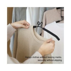 Space-saving clothes hanger by closet curtain